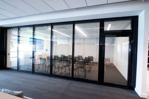 Room with glass panel partition